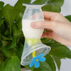 Haakaa Extractor de leche de silicona con base de succión y tapón de flores