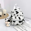 Mochila de vaca con colgante de vaca de felpa con estampado de vaca