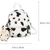 Mochila de vaca con colgante de vaca de felpa con estampado de vaca