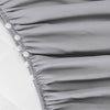 Falda de cama para cuna Biloban color gris, plisada de 4 lados