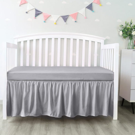 Falda de cama para cuna Biloban color gris, plisada de 4 lados