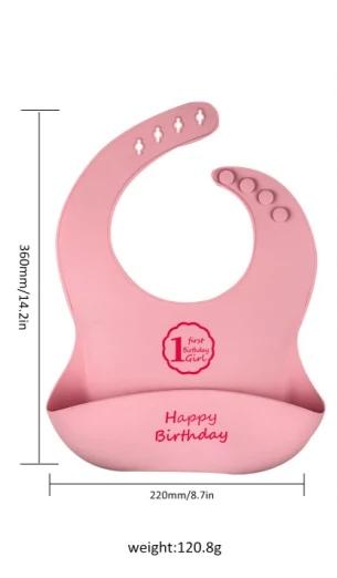 Set de 2 baberos de silicona rosado, "1st birthday girl" - "I am a good baby"