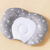 Almohada moldeadora para bebés, diseño gris con lunas y estrellas