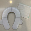 Frida Baby- Asiento de orinal portátil plegable